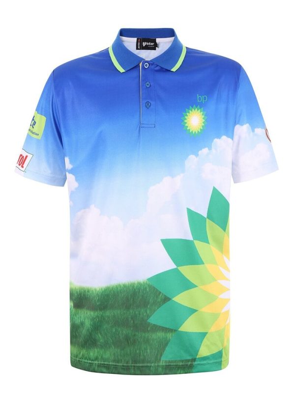 Bright blue polo shirt with cloud and grass landscape print, featuring corporate logos and green accents, designed for promotional uniforms and custom corporate clothing.