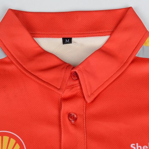 Shell branded red and yellow work uniform polo shirt with reflective strips and a button-up collar, designed for industrial or safety work environments.