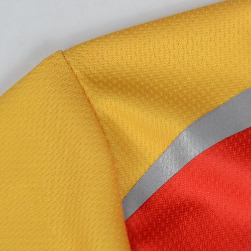 High-visibility safety vest fabric with yellow, red, and gray reflective strips, designed for workwear uniforms, ensuring safety and durability for industrial and construction environments.