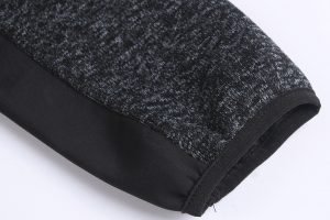 High-quality black and gray knit fabric sleeve with durable stitching, ideal for custom uniform clothing and workwear apparel manufacturing in China.