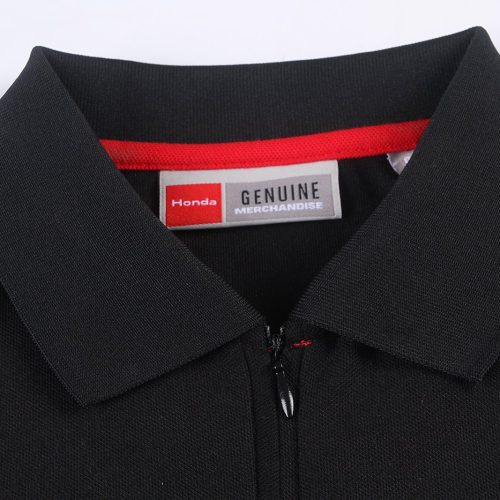 Black custom polo shirt with a polyester blend, featuring a zipper collar, made for branding and uniform purposes. High-quality craftsmanship suitable for corporate or team uniforms.