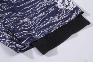 Blue and white custom printed fabric with dragon and wave patterns, ideal for creating unique clothing uniforms by a China-based manufacturer.