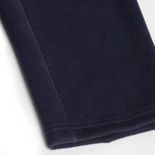 Pure navy blue custom workwear fabric cuff close-up for professional uniform clothing.