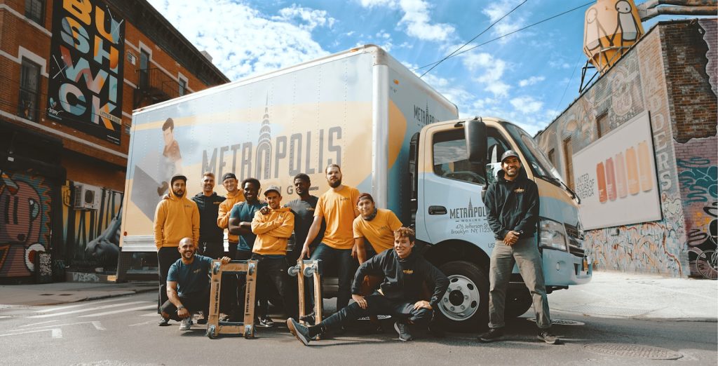 Customized workwear uniforms on delivery team in urban street scene, showcasing high-quality professional apparel from China manufacturer.