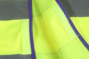 High-visibility safety vest fabric with neon yellow and purple trim for customizable work uniforms.