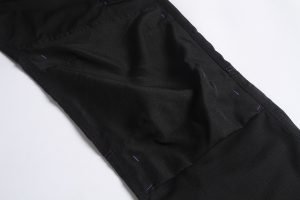 High-quality black workwear fabric with reinforced stitching for durability and comfort, ideal for custom uniforms made in China. Perfect for industrial, security, or corporate apparel.