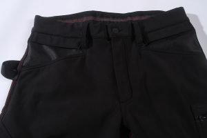 Durable black work pants with multiple pockets, reinforced stitching, and comfortable waistband for industrial, construction, or factory work. Customized clothing uniforms for workplace safety and professionalism.