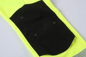High-visibility safety vest with multiple pockets and reflective strips for construction and industrial workers. Customizable uniforms made in China for durable and professional workwear.