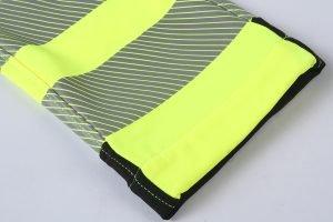 High visibility safety vest with reflective stripes, used for construction, traffic control, and industrial safety. Customizable for various work environments to enhance worker visibility.