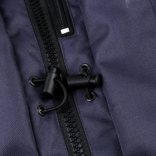 Durable navy blue workwear jacket with sturdy zipper and adjustable toggle for professional uniforms. Perfect for industrial and corporate environments requiring functional work clothing.