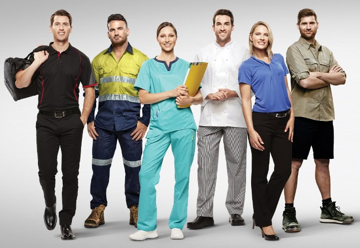Black uniformed man with a backpack standing confidently among diverse professional workers in various workwear outfits.
