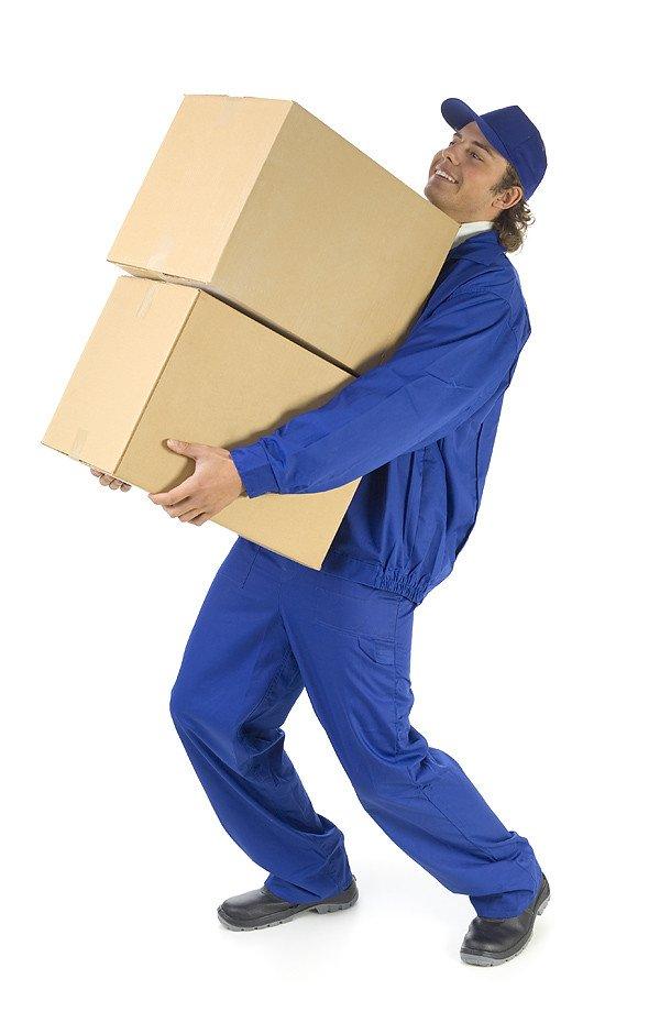 Stacking worker in blue uniform holding cardboard boxes, representing packaging and delivery services.