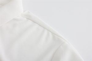 Smooth white custom workwear fabric showcasing high-quality materials for professional uniforms and clothing. Perfect for creating durable, comfortable workwear.