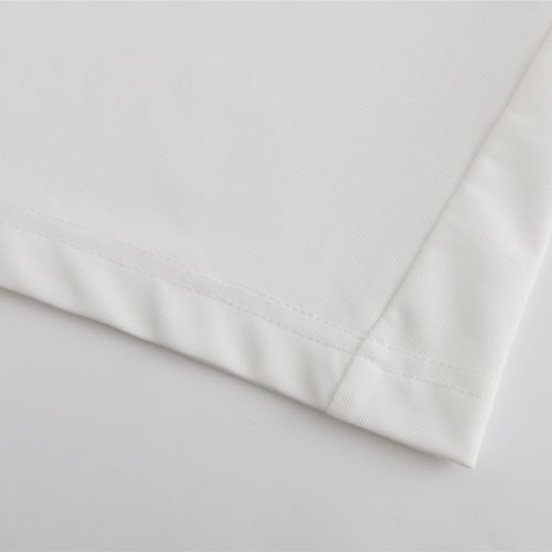 White custom work uniforms fabric close-up with stitching detail for professional clothing manufacturing.