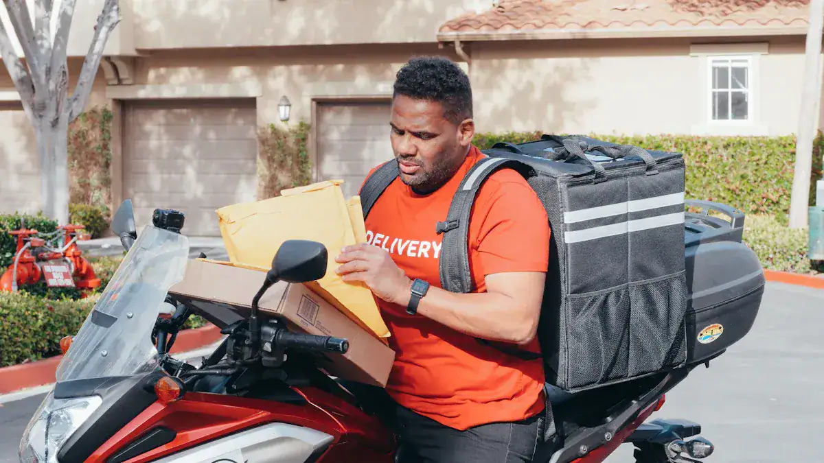 Delivery man inspecting packages on a motorcycle for online order distribution.