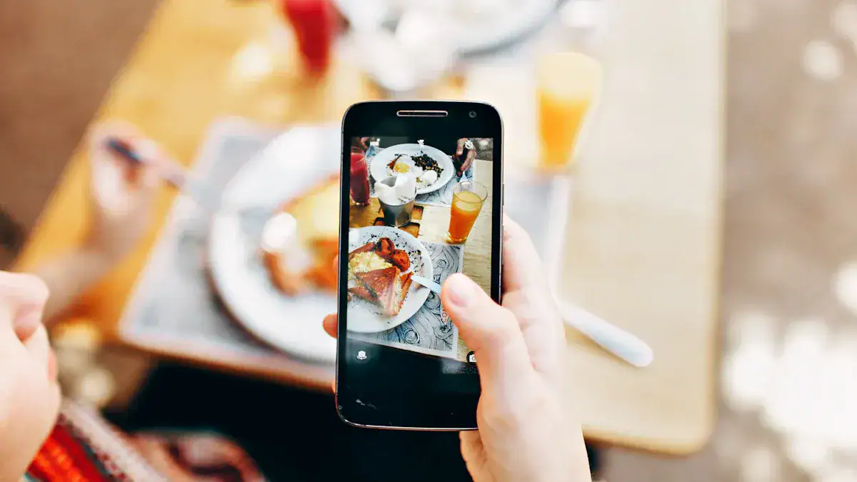 High-quality custom clothing uniforms being photographed on a smartphone in a restaurant setting, showcasing professional apparel manufacturing services from China.
