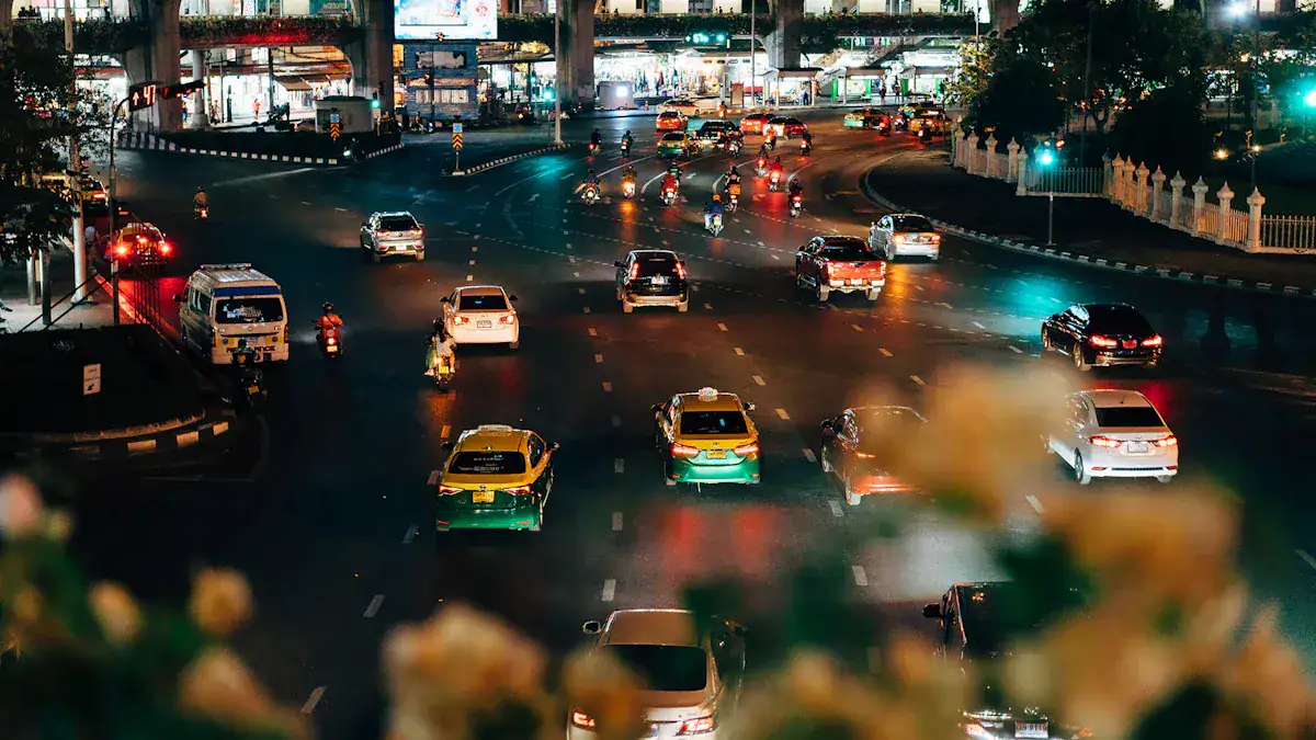 Night city traffic with illuminated vehicles on a busy urban road.
