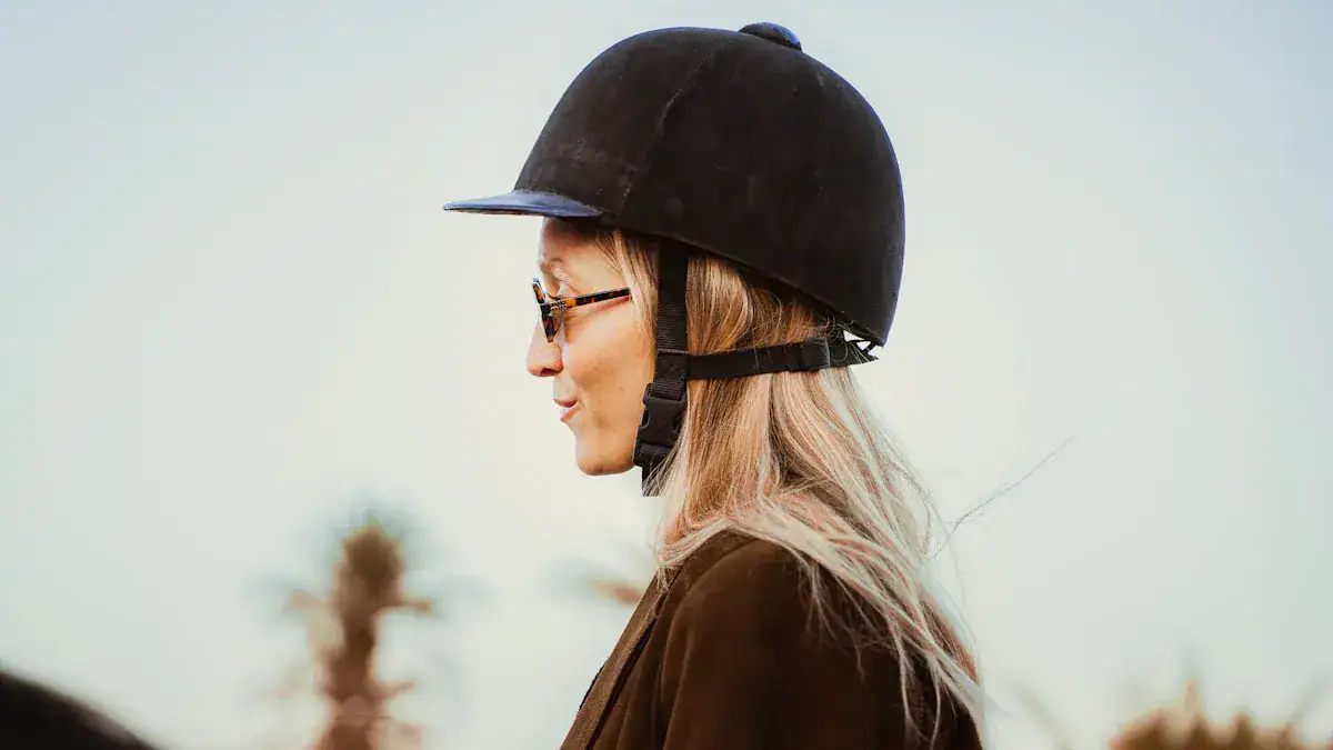 Reflective jacket and black safety helmet worn by a woman outdoors, emphasizing safety workwear for industrial or construction environments.