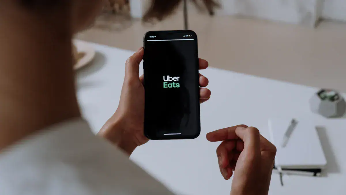 Uber Eats app displayed on a smartphone being held by a woman.