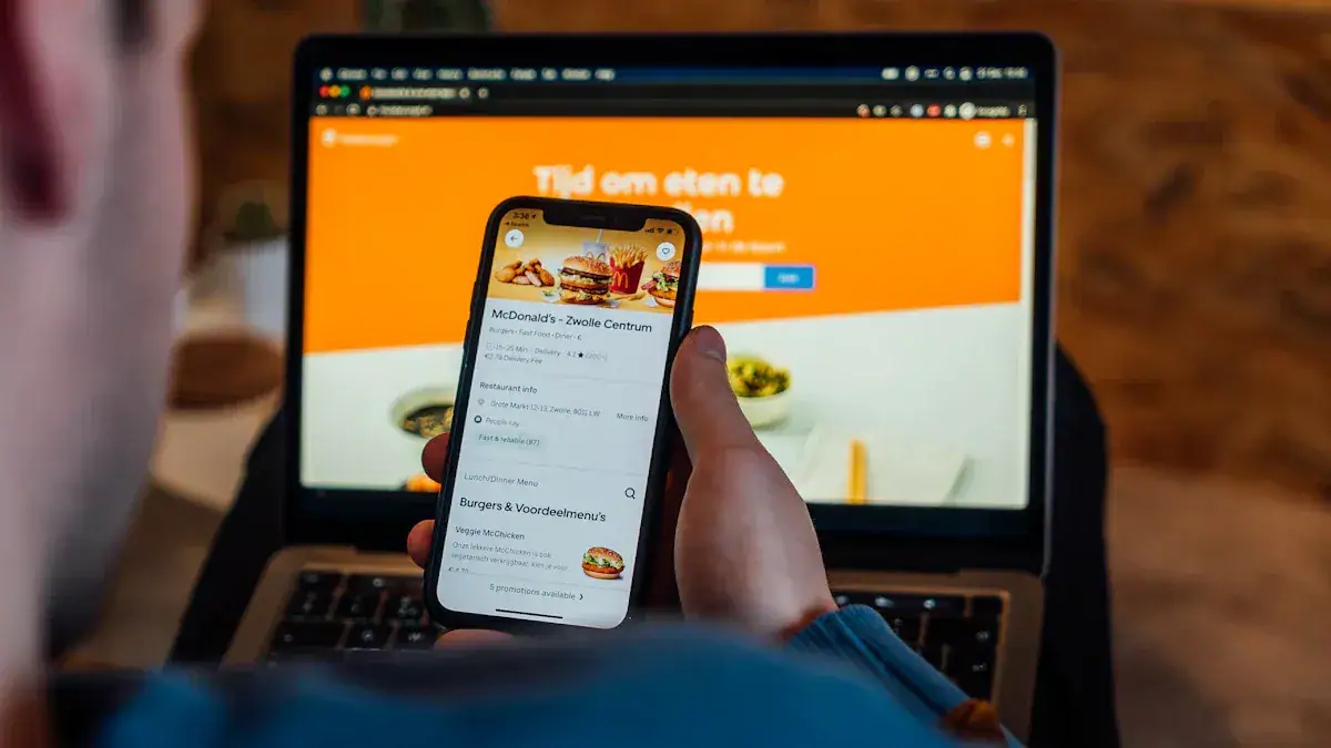 High-resolution image of a person ordering fast food via smartphone with McDonald's menu visible, laptop in the background on a wooden desk, illustrating digital ordering and food delivery services.