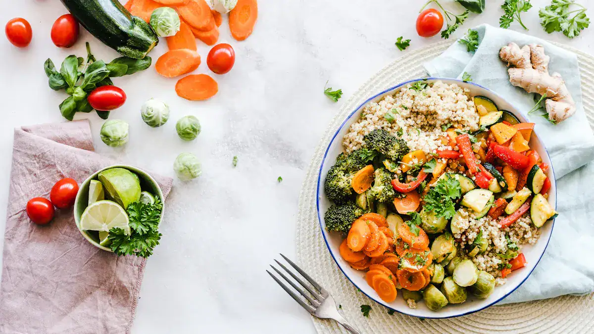 Fresh vegetable quinoa salad with vibrant, colorful vegetables and herbs on a white plate, served alongside lime, jalapeno, and ginger on a bright, clean background.