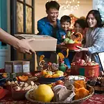 Brightly lit family celebration with colorful decorations and traditional snacks, capturing a joyful moment of exchanging gifts and enjoying festive treats.
