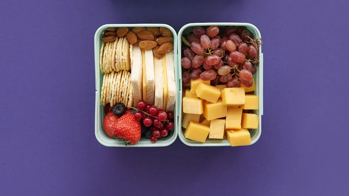Fresh fruit and cheese snacks in a bento box on a purple background.