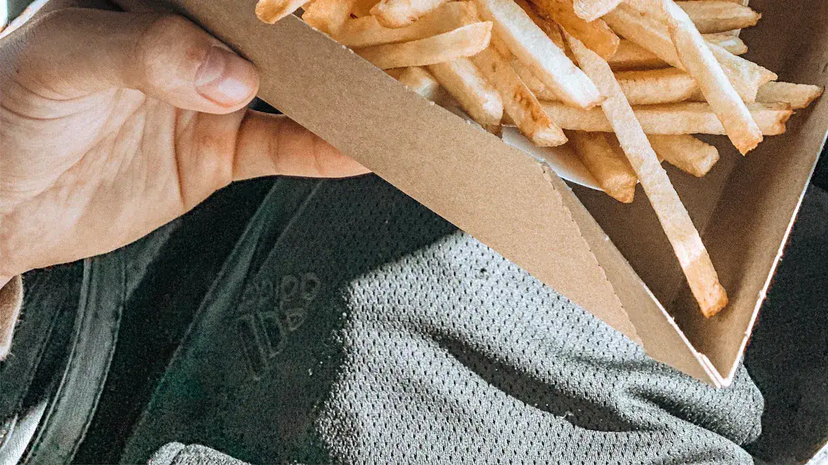 French fries in a cardboard box.