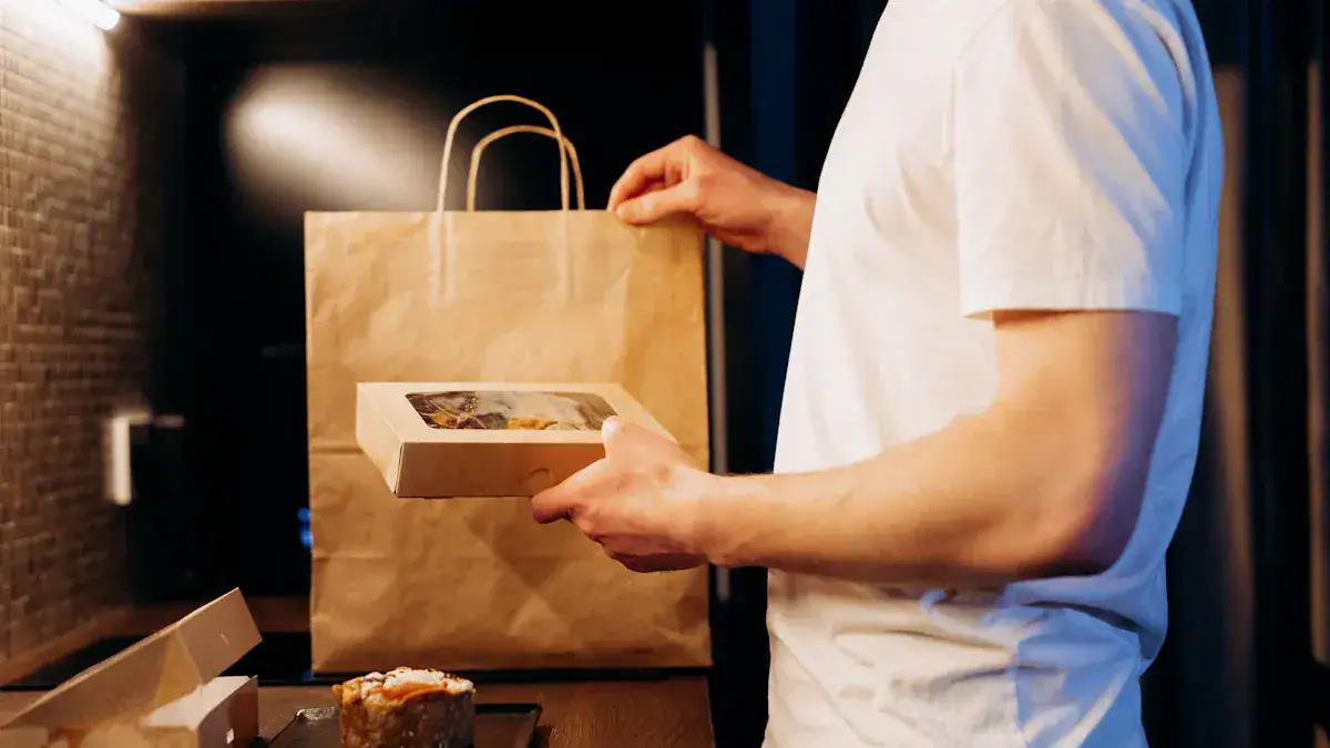 Freshly prepared takeout pizza being handed over in a casual dining setting, emphasizing quality food packaging and customer service.