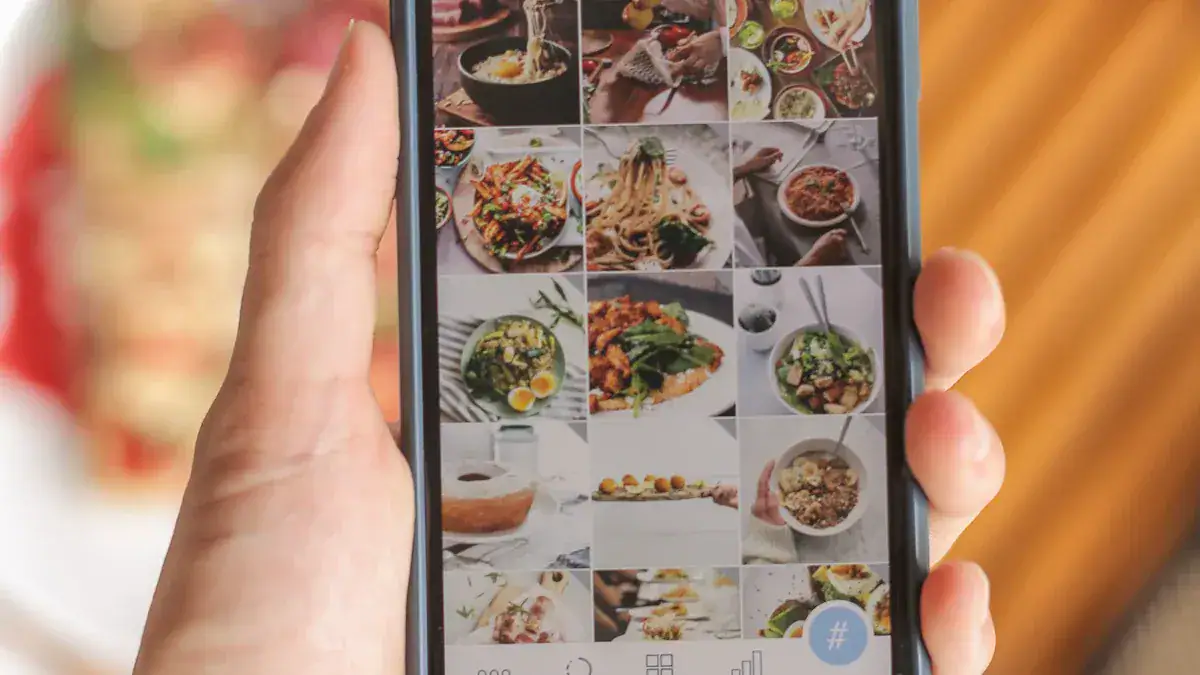 High-quality image of a smartphone displaying a food photo gallery with various Asian dishes on a blurred background.