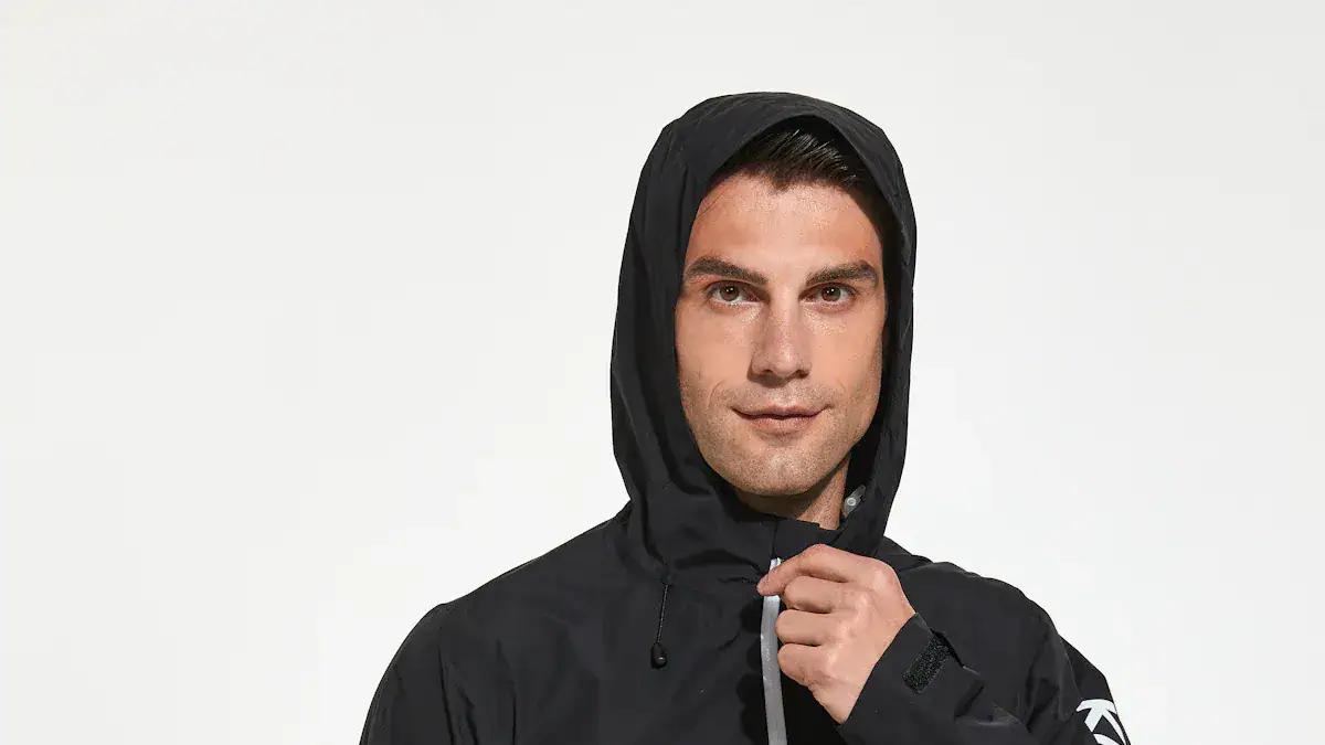 Reflective black waterproof rain jacket with hood, suitable for outdoor work and activities, showcasing custom clothing manufacturing by Sha in China.