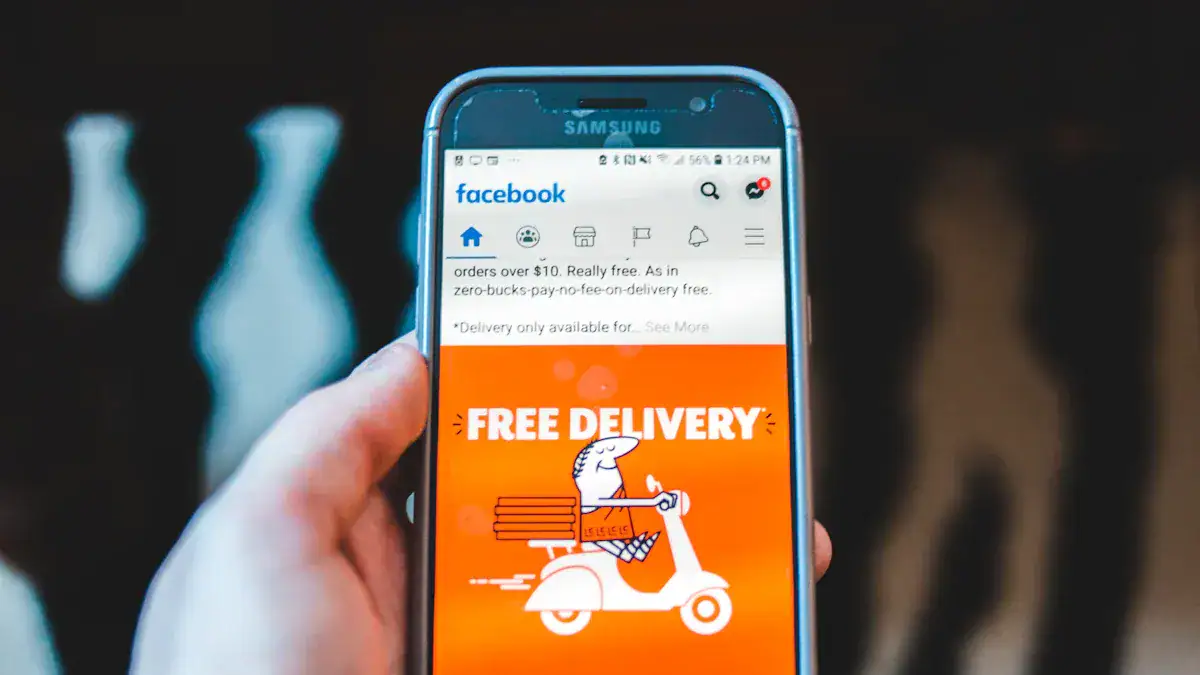 High-quality smartphone with Facebook app showing free delivery promotion for custom workwear clothing orders from a Chinese manufacturer.