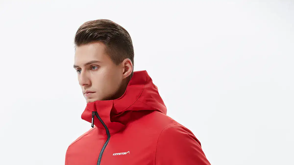 High-quality red custom jacket with hood and waterproof features, ideal for corporate and work uniforms, manufactured by a leading China-based workwear supplier.