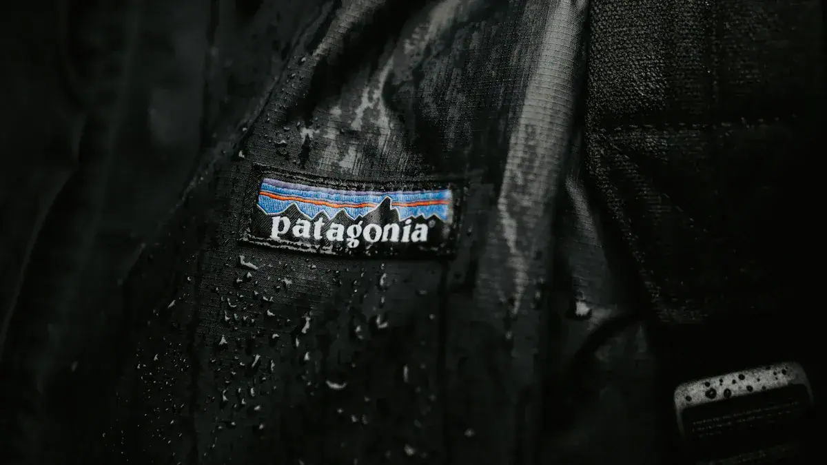 Water-resistant black Patagonia jacket with water droplets on the fabric, showcasing high-quality outdoor apparel suitable for wet weather conditions.