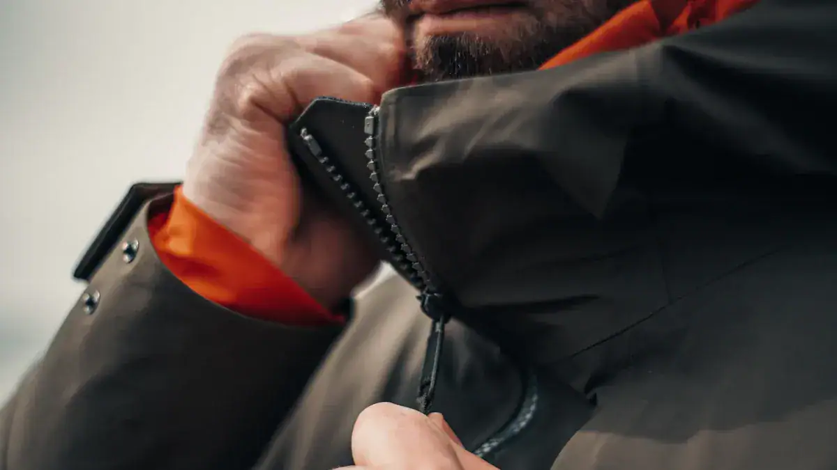 Durable black waterproof jacket with a zipper and adjustable collar, perfect for outdoor work and activities.
