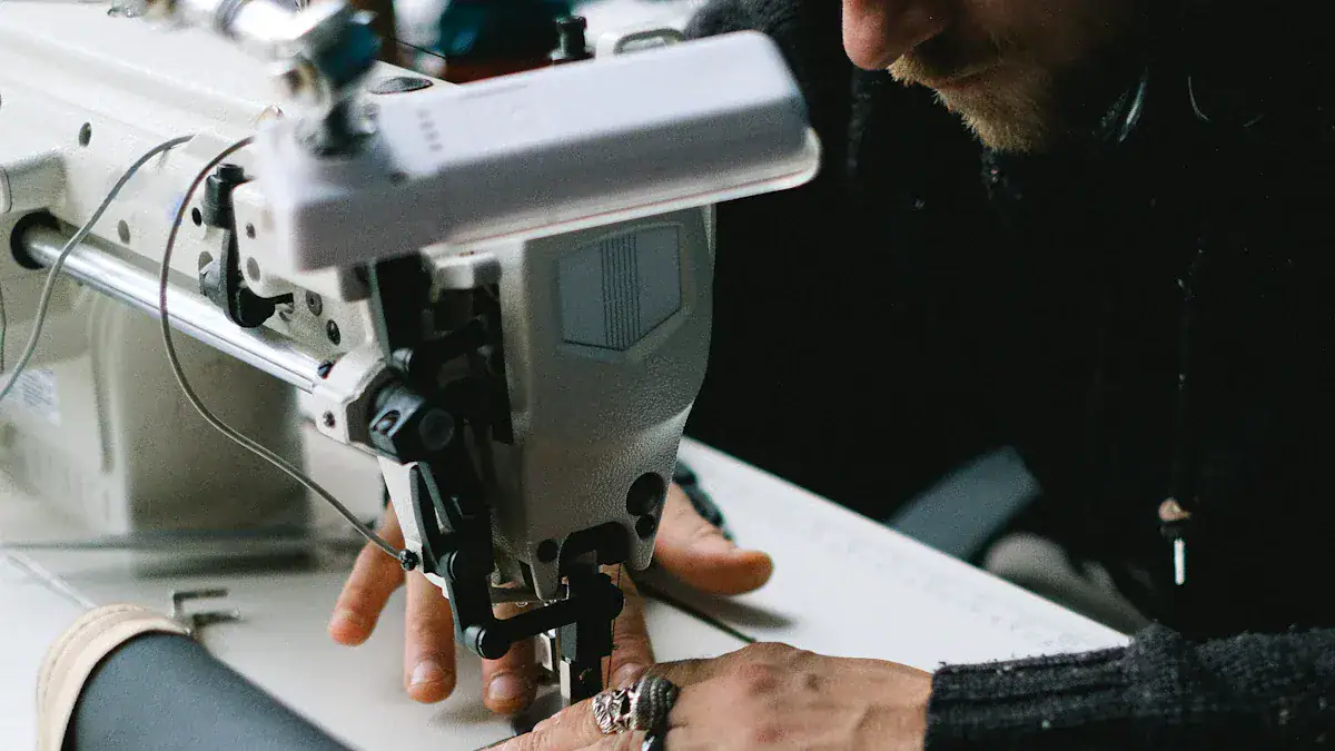 Close-up of a worker sewing custom clothing uniforms on a professional sewing machine in a manufacturing facility. Precision craftsmanship ensures high-quality workwear for various industries.