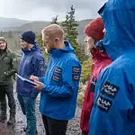 Waterproof workwear jackets for outdoor activities in rainy weather, suitable for team building and adventure excursions in wet conditions.