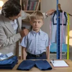 Custom school uniform fitting and tailoring by Sha manufacturer in China.