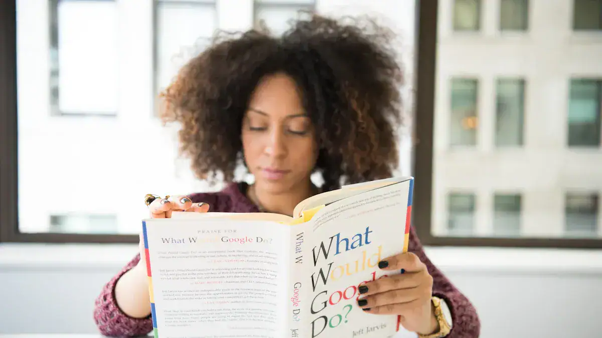 Elegant woman reading a book in a modern office setting, with large windows and natural light.