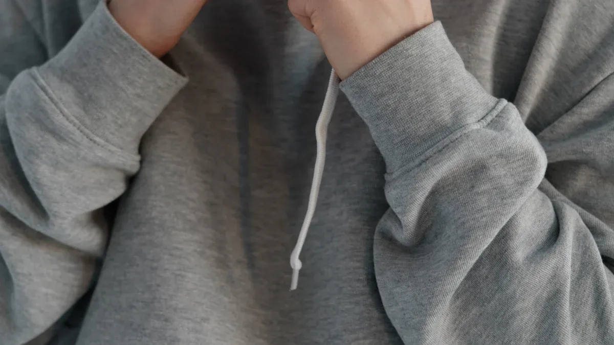 Gray hoodie with drawstrings, casual unisex sweatshirt, comfortable workwear clothing for men and women.