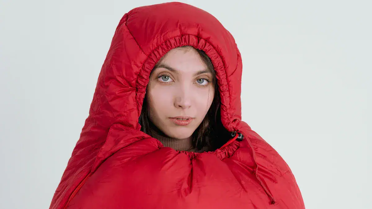 Warm red puffer jacket with hood, designed for outdoor weather protection, showcasing custom clothing and uniforms manufacturing from China. Perfect for cold climates and outdoor work environments.
