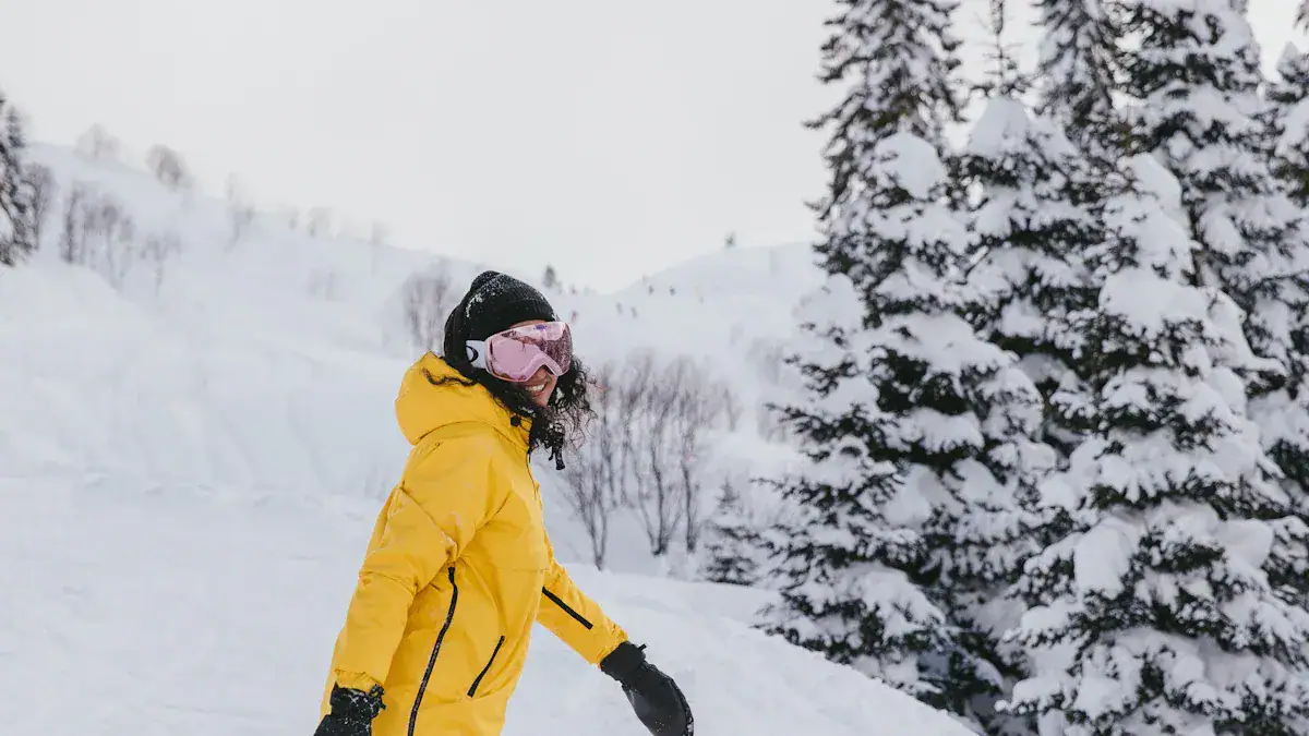 Bright yellow winter ski jacket for women, designed for outdoor snow activities and warmth. Made with high-quality, custom materials from China for durability and comfort.