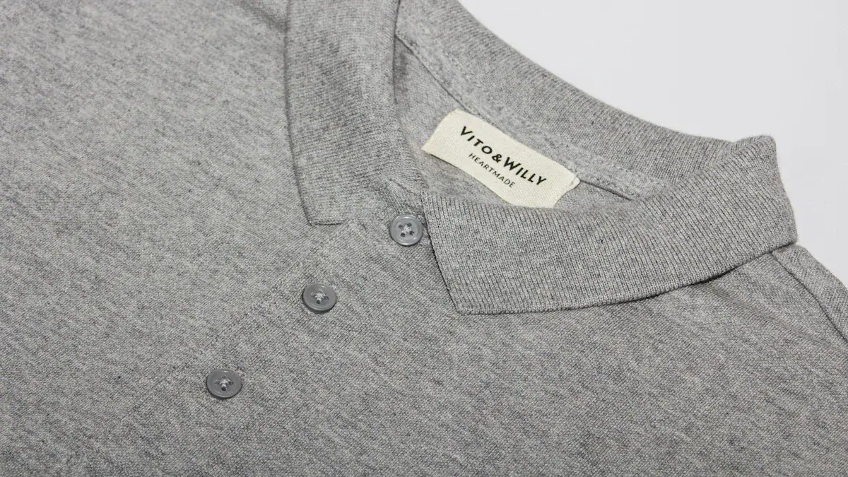High-quality gray polo shirt fabric with buttons and collar detail, perfect for custom uniforms and workwear solutions from trusted China manufacturer Sha.