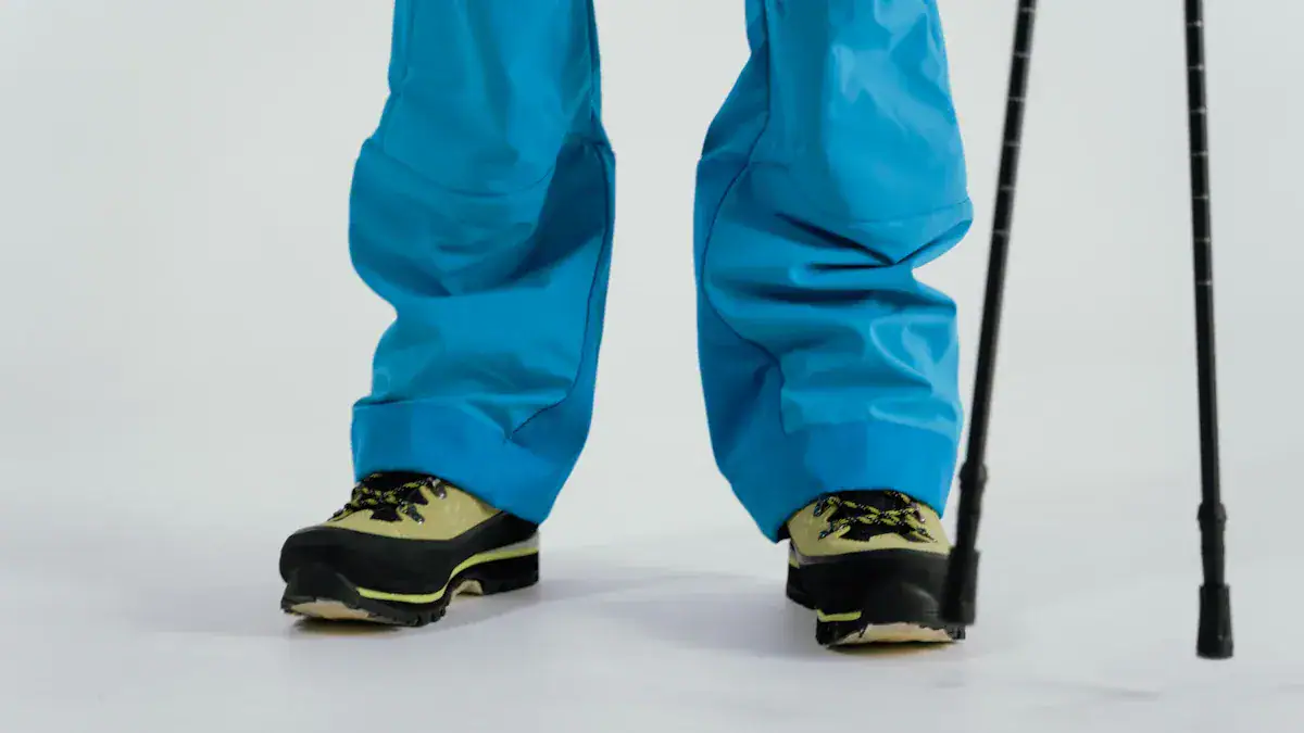 Comfortable blue work pants with hiking shoes and crutches, designed for durable and functional workwear, suitable for industrial or outdoor environments.