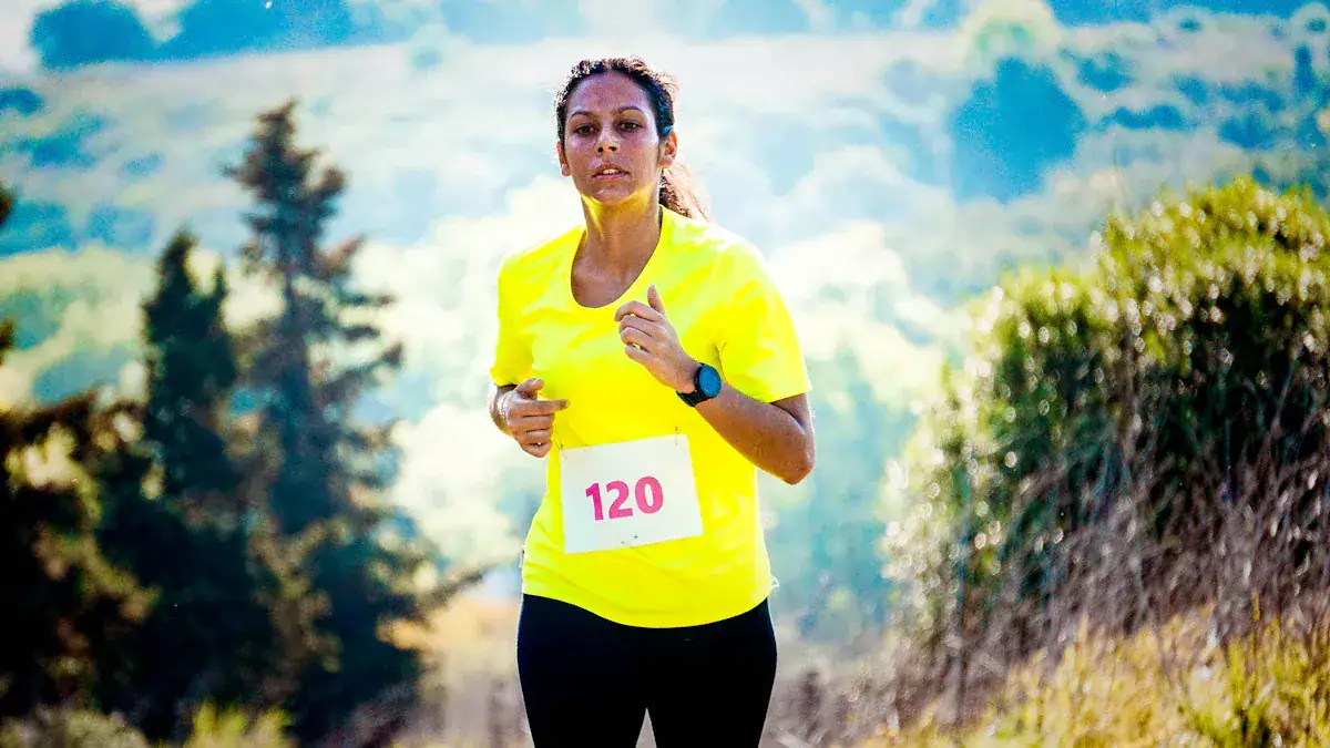 Bright yellow custom running t-shirt worn by a female athlete during a race in an outdoor setting.
