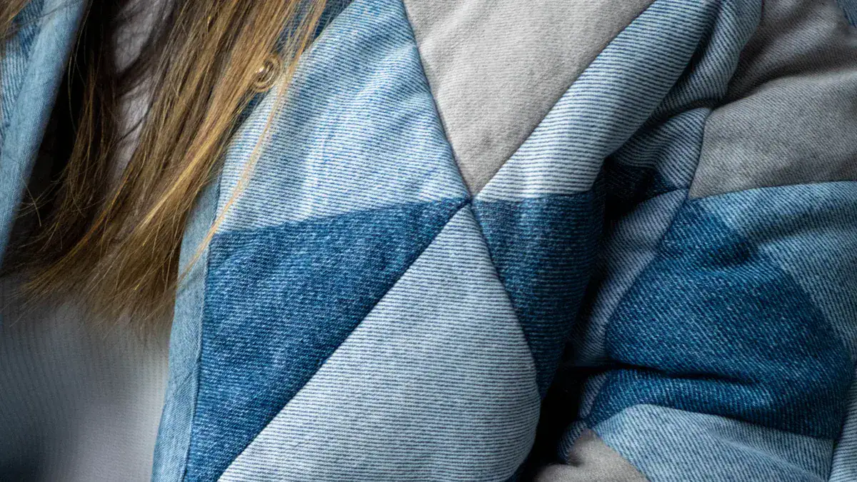 High-quality custom denim clothing and uniforms manufactured in China, featuring diverse fabric patterns and durable materials for professional and casual wear.